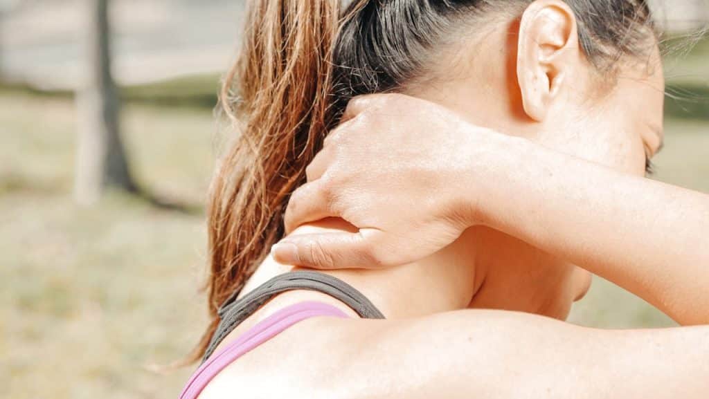 Close-Up Photo of Woman Having a Neck Pain